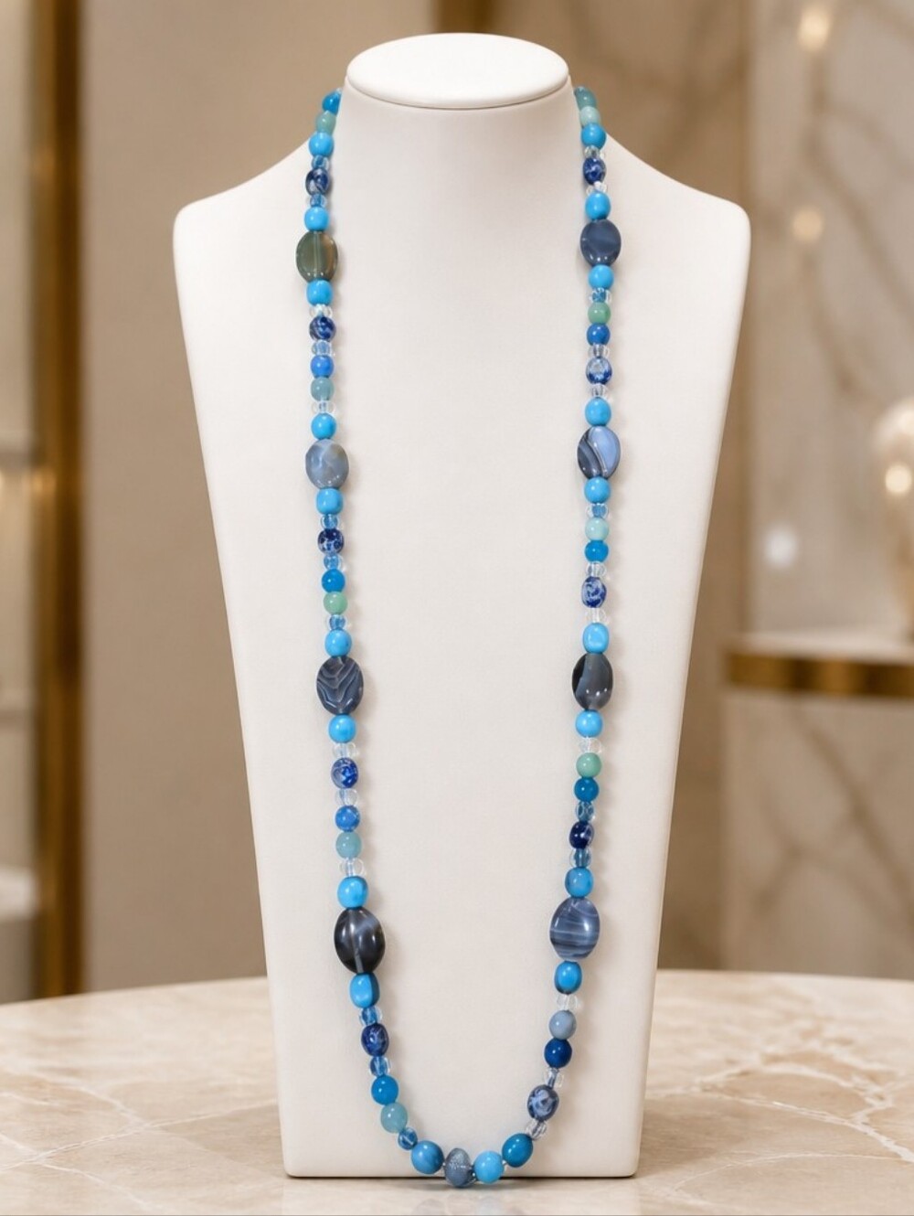 This is a mixed gemstone and glass bead statement necklace